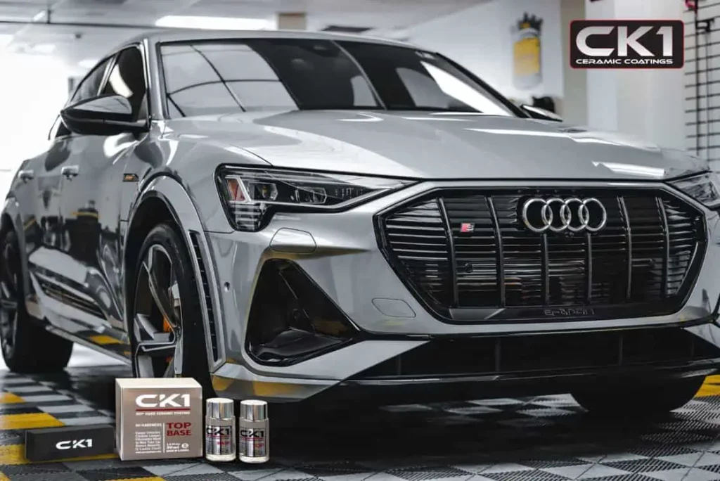 A silver Audi SUV with ceramic coating is parked in a garage.