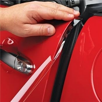 A hand checking the alignment and seal of a red car door, with the car's exterior clearly visible, showcases the precision needed in Paint Protection Film Training.