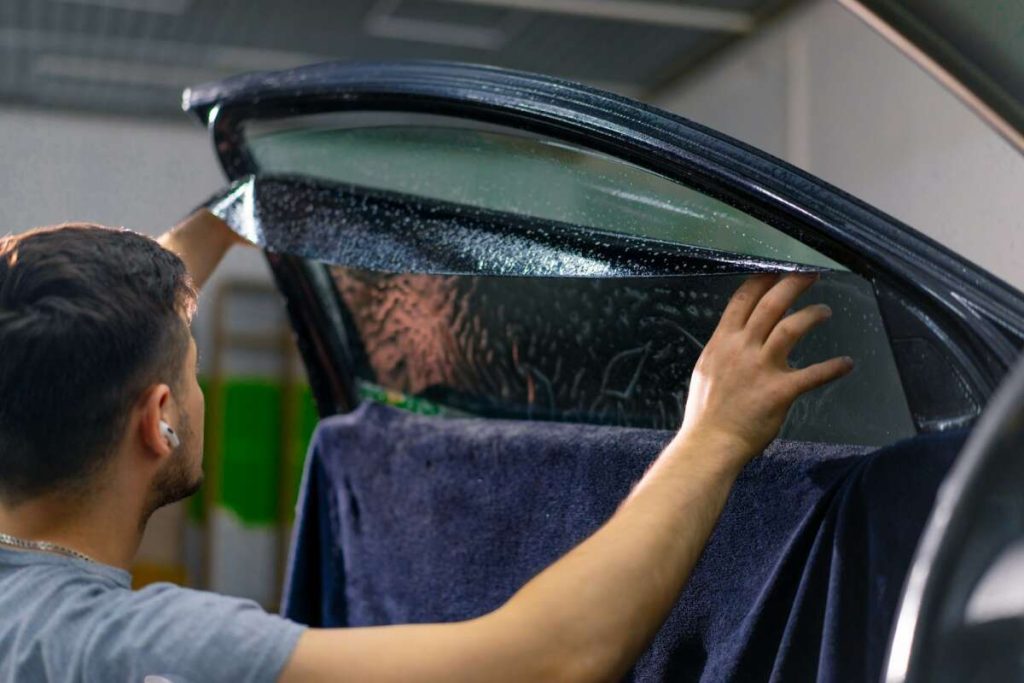 Applying tint film to a car window is an intricate process that requires precision and skill, much like what is taught in Paint Protection Film Training. This attention to detail ensures not only enhanced privacy but also improved protection against the elements.